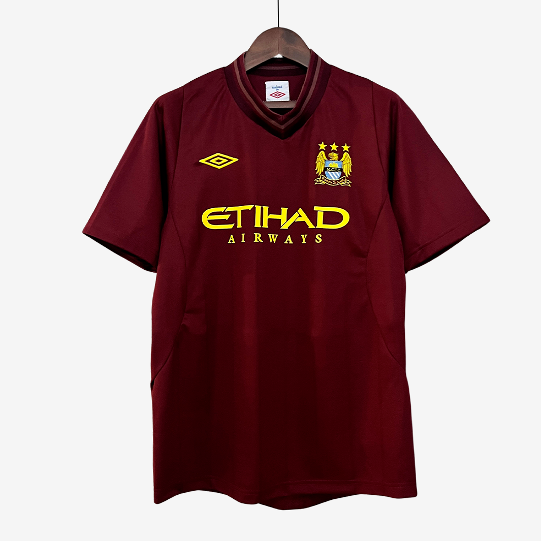 5-149_96caca11-f375-4ebb-be96-c6bc7a785707 Camiseta Visitante Manchester City 2012/13 – Versión Retro - Imagen 1