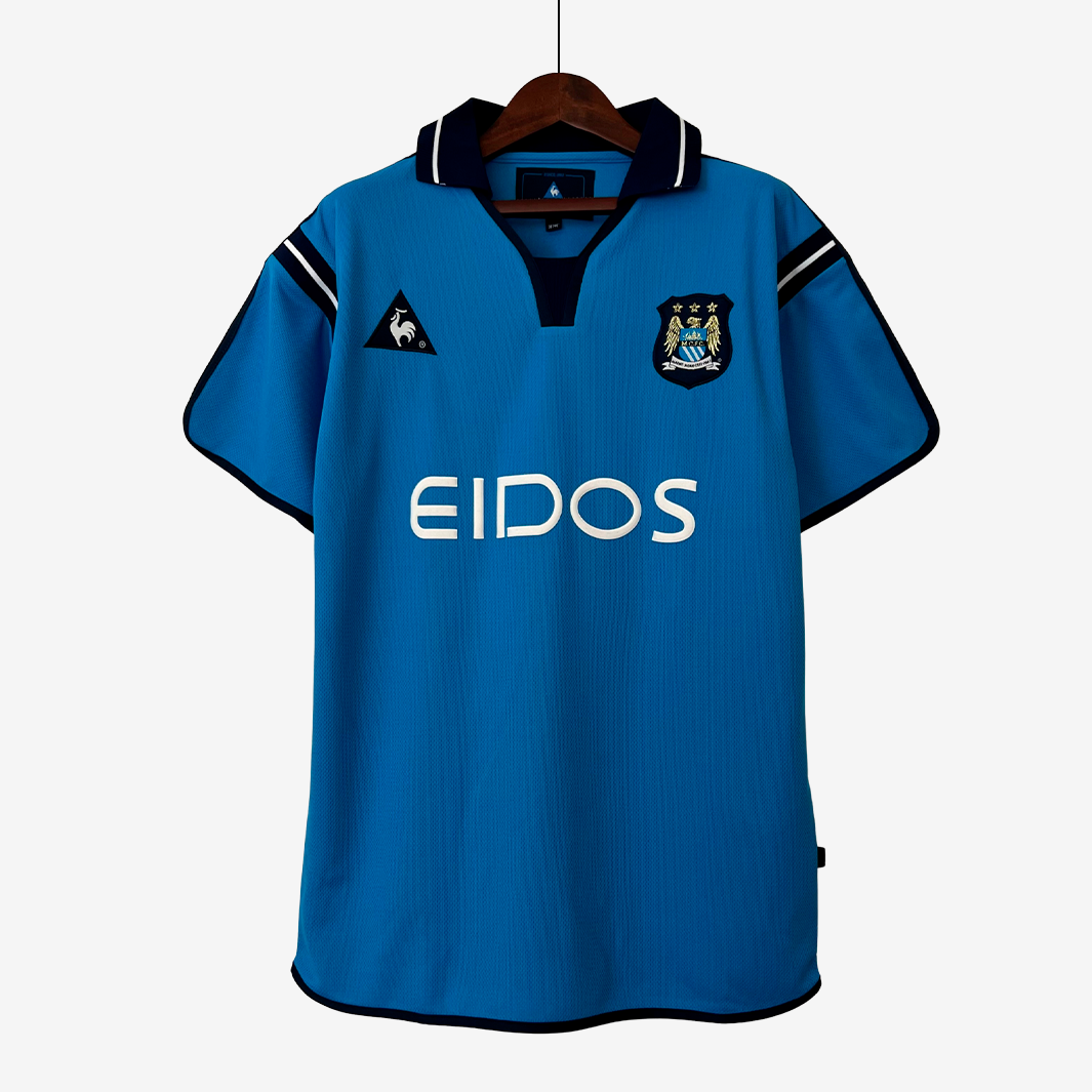 6-42 Camiseta Local Manchester City 2001/02 – Versión Retro - Imagen 1